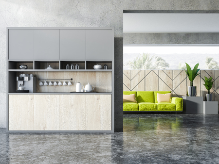 Interior of studio apartment with kitchen corner, and green comfortable sofa with cushions. 3d renderingの写真素材