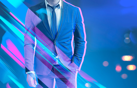 Unrecognizable businessman in dark suit standing over a dark blue background. 3d glasses effect. Toned image mock upの写真素材