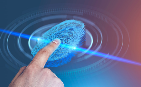Hand of man using fingerprint in hud immersive interface over blurred blue red background. Concept...