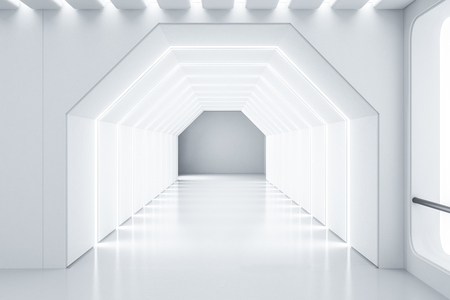 Futuristic empty white hexagonal shaped corridor with lighted ceiling and walls. Concept of creativity in architecture and hi tech. 3d renderingの写真素材