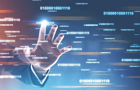 Hand of businessman touching blue purple background with white glowing lines of code on it. Concept of hi tech, programming and technology in business. Toned image double exposureの写真素材