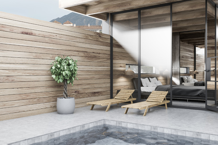Corner of private pool with wooden walls, deck chairs, a tree in a pot and bedroom in the background. Luxury lifestyle concept. 3d renderingの写真素材