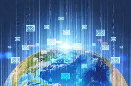 Glowing email icons above earth surface over dark blue background with lines and bubbles. 3d rendering toned image double exposureの写真素材