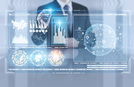 Unrecognizable businessman in office using infographics interface. Hud. Toned image double exposure.