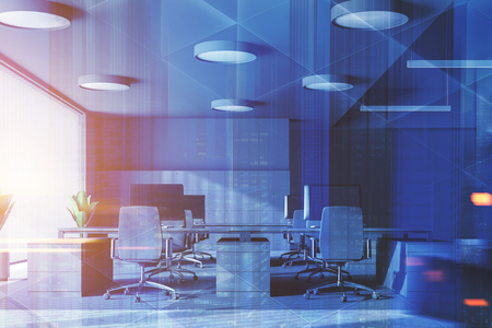 Interior of panoramic office with gray walls, concrete floor, rows of gray computer tables with gray chairs and potted plants. 3d rendering toned image double exposure of cityの写真素材