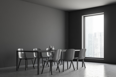 Interior of minimalistic dining room with gray walls, concrete floor, loft window and gray table with six gray chairs. 3d renderingの写真素材