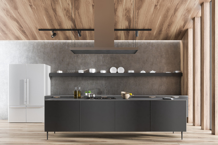 Interior of modern kitchen with gray walls, wooden floor, gray countertops with built in sink, a...