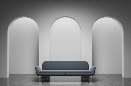 Interior of stylish room with white walls, three arches in them and long gray sofa standing on stone floor. 3d renderingの写真素材