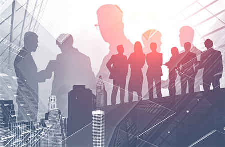 Silhouettes of business people talking and working together in modern city. Concept of business...