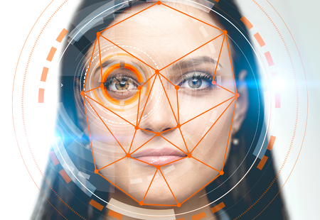 Face of beautiful young woman with colorful hud interface near her eye and biometric verification interface. Concept of face recognition and hi tech. White background. Toned image double exposureの写真素材
