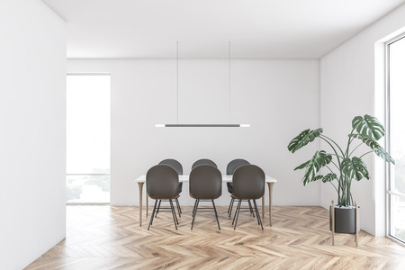Interior of modern dining room with white walls, wooden floor, large windows, white table with gray...