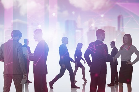 Silhouettes of business people working together and communicating over purple cityscape background with network interface. Concept of hi tech. Toned image double exposureの写真素材