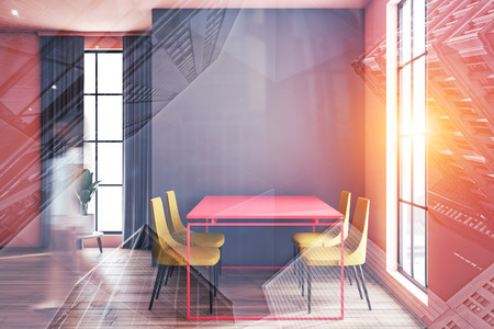 Woman walking in stylish bright dining room with gray and white walls and pink table with yellow chairs. Toned image double exposure blurの写真素材