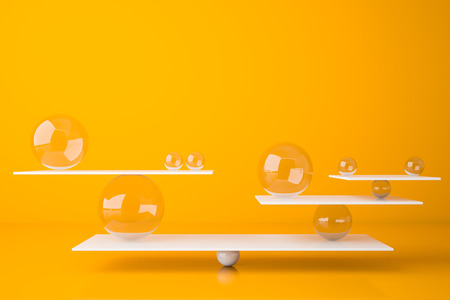 White balanced seesaw with glass balls standing in bright yellow room. Concept of balance and weight. 3d renderingの写真素材