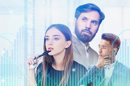 Thoughtful diverse team of business people with double exposure of graphs. Concept of business...