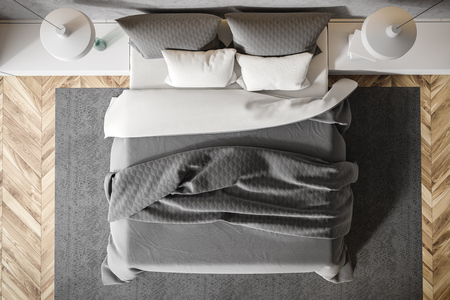 Top view of master bedroom interior with stone walls, wooden floor, king size bed standing on gray carpet and two ceiling lamps. 3d renderingの写真素材