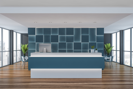 Blue and white reception table with computer on it standing in modern office interior with blue walls, wooden floor and open space area in background. 3d renderingの写真素材