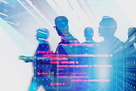 Diverse team of computer engineers in server room interior double exposure of blurred lines of code. Concept of big data and cloud computing. Toned imageの写真素材