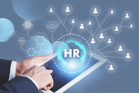 Man hand with tablet computer and double exposure of HR and social connection HUD interface. Concept of recruitment and hi tech. Toned imageの写真素材