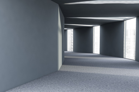Futuristic interior of empty business building corridor with gray walls, concrete floor and windows with modern cityscape. Interior design concept. 3d renderingの写真素材