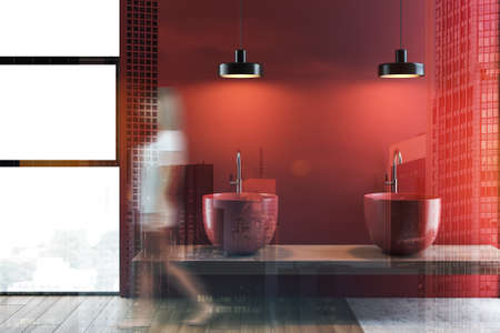 Young woman walking in modern bathroom interior with red walls, wooden floor, and red double sink standing on wooden shelf. Toned image double exposure blurredの写真素材