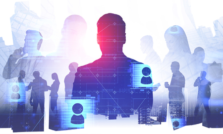 Silhouettes of business people over abstract city background with double exposure of social media icons. Concept of hi tech and social connection in business. Toned imageの写真素材