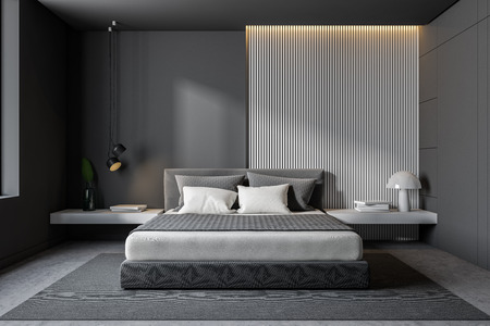 Interior of minimalistic bedroom with gray and wooden walls, concrete floor, gray master bed with...
