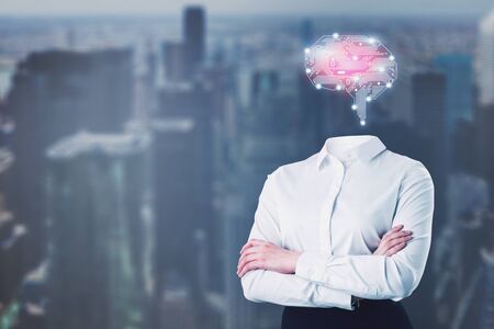 Businesswoman in white shirt with circuit brain hologram standing with crossed arms over blurred city background. Concept of artificial intelligence and brainstormingの写真素材