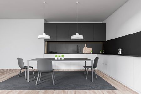 Interior of minimalistic kitchen with white and gray walls, wooden floor, white countertops, black...