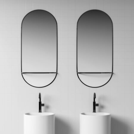 Close up of double bathroom sink with two oblong mirrors above it standing in modern room with white walls. 3d renderingの写真素材