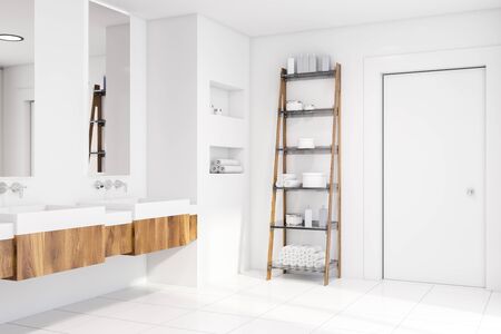 Interior of stylish bathroom with white walls, tiled floor, white and wooden double sink with...