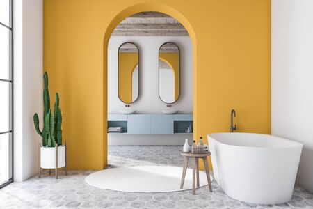 Interior of modern bathroom with white and yellow walls, tiled floor, white bathtub and double sink on blue countertop with mirrors in background. 3d renderingの写真素材