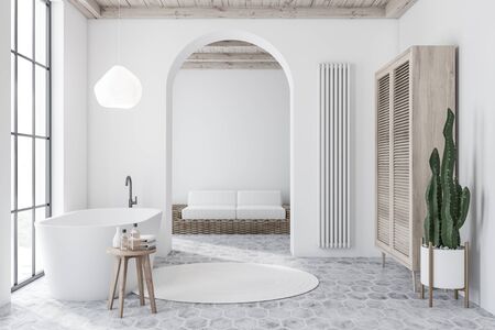 Interior of modern bathroom with white walls, tiled floor, white bathtub and wooden wardrobe and living room with sofa in background. 3d renderingの写真素材