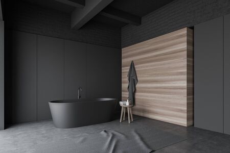 Corner of stylish bathroom with gray, brick and wooden walls, concrete floor, comfortable gray bathtub and carpet on the floor. 3d renderingの写真素材