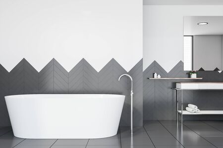 Interior of stylish bathroom with white and gray walls, tiled floor, white bathtub and comfortable white sink standing on countertop in background. 3d renderingの写真素材