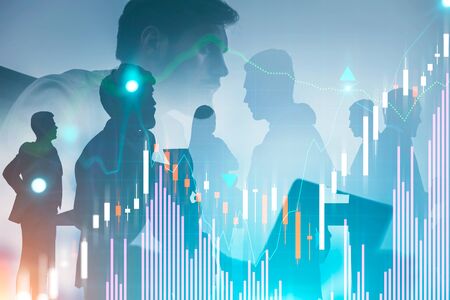 Serious businessman with laptop and members of his team over white background with double exposure of graphs. Concept of leadership and stock market. Toned imageの写真素材