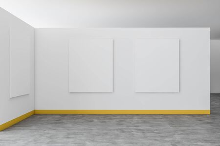 Interior of modern art gallery with white and yellow walls, concrete floor and vertical mock up posters. Concept of advertising. 3d renderingの写真素材