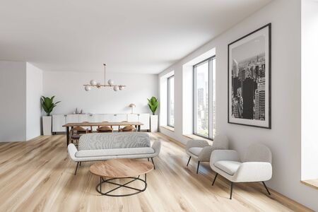 Interior of spacious living room with white walls, wooden floor, white sofas and armchairs near...