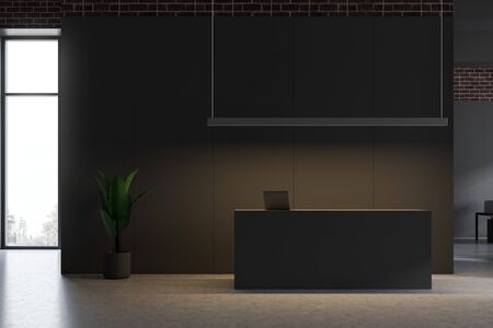 Gray reception table standing in modern office interior with gray and brick walls and concrete floor. 3d renderingの写真素材