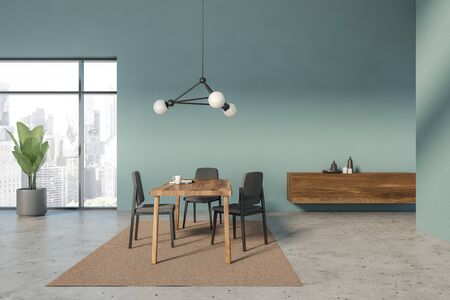 Interior of loft dining room with blue walls, concrete floor, wooden table with gray chairs, beige...