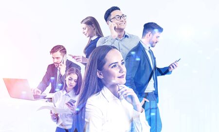 Diverse team of business people working together over white background with double exposure of graph. Concept of stock market and teamwork. Toned imageの写真素材