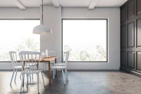 Interior of minimalistic loft dining room with gray and white walls, concrete floor, wooden table...