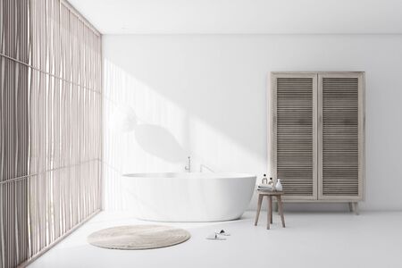 Interior of comfortable bathroom with white walls and floor, light wooden blinds, comfortable white...