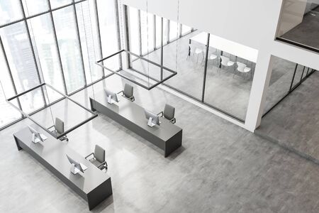 Top view of modern open space office with white walls, panoramic windows, row of long gray computer tables and conference room with glass walls in background. 3d renderingの写真素材