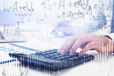 Hand of man using calculator at office table with double exposure of formulas. Concept of science...