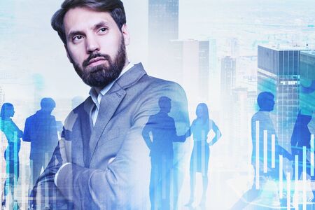 Confident young businessman standing in modern city with double exposure of his employees and forex...