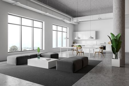 Corner of modern kitchen and living room with white walls, concrete floor, white countertops, bar with stools, dining table and gray sofas near coffee table. 3d renderingの写真素材
