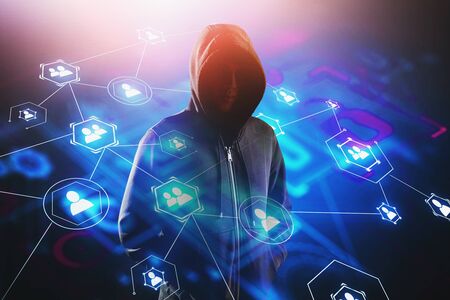 Unrecognizable young hacker standing over blurry background with double exposure of social media...