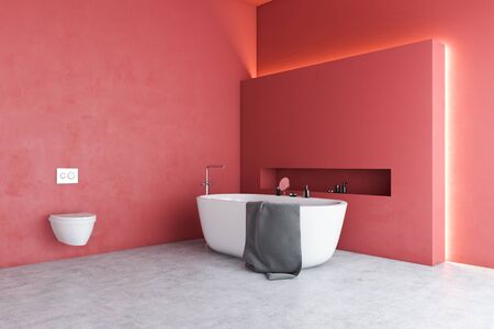 Corner of stylish bathroom with red walls, concrete floor, comfortable white bathtub and toilet. Concept of luxury house. 3d renderingの写真素材