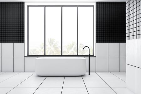 Interior of stylish minimalistic bathroom black tiled walls, white tiled floor and comfortable white bathtub standing under window with tropical scenery. 3d renderingの写真素材